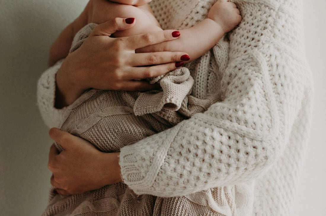 mom holding her baby
