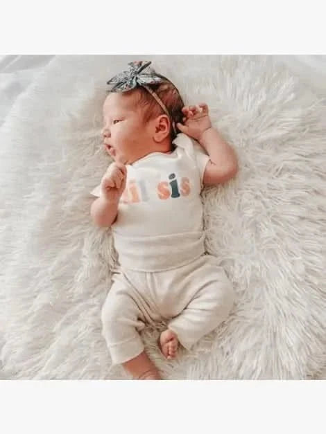 Baby graphic bodysuit | lil sis Finn + Emma